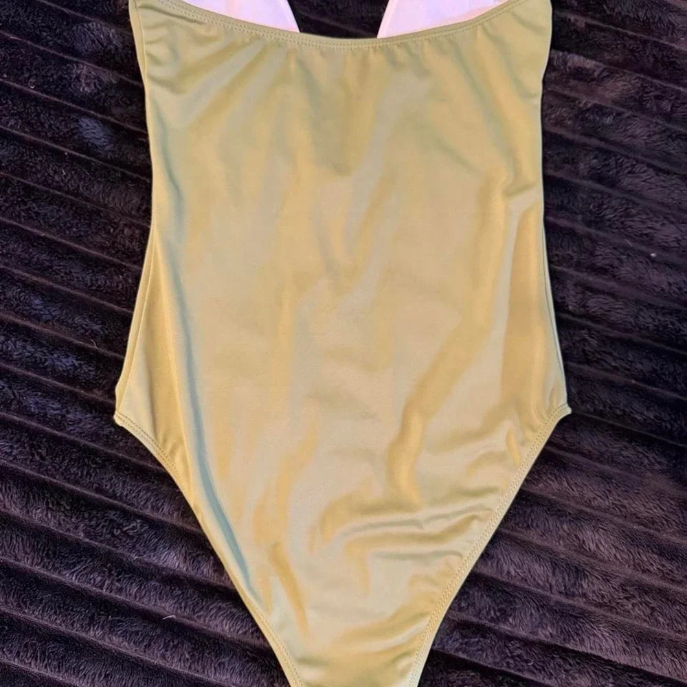 Green one piece bodysuit. Can be worn as a bodysuit.